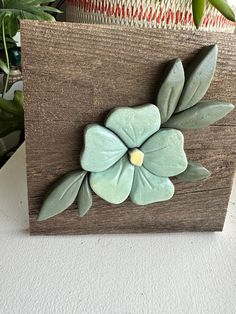 a wooden box with some flowers on it