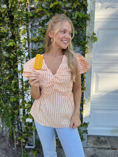 Our Tangerine Gingham Ruffle Top is so girly and fun for the spring/summer season! Featuring a v-neckline, ruffle sleeves, and shirring detail. lined bust stretchy back detail 100% polyester care instructions: hand wash cold slightly oversized, relaxed fit Sarah is 5'3" wearing a small Gingham Ruffle Tops For Vacation, Gingham Ruffled Tops For Vacation, Gingham V-neck Top For Day Out, Summer V-neck Top For Picnic, Summer Gingham V-neck Top, Spring Gingham V-neck Top, Gingham V-neck Tops For Spring, Summer Puff Sleeve Tops For Picnic, Summer Ruffles Top For Picnic