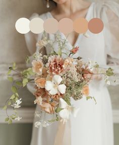 a woman holding a bouquet of flowers in front of a wall with color swatches