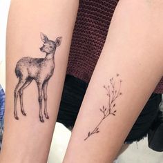 two people with matching tattoos on their arms, one has a deer and the other has a plant