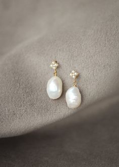 Clover are a set of pearl drop earrings that are a tribute to timeless beauty. These exquisite earrings are designed to add a touch of sophistication and grace to your bridal ensemble, enhancing your natural beauty without overpowering your overall look. * DETAILS * > Freshwater pearls, gold or antique silver plated findings > Dimensions: 25mm length (11-12mm pearl) * READY TO SHIP * The Clover earrings are ready to ship. Please allow 5-7 business days for processing plus delivery times. Please Timeless Pearl White Earrings With Pearl Charm, Elegant Yellow Gold Pearl Earrings For Wedding, Anniversary Bridal Earrings With Pearl Drop In Yellow Gold, Graceful Yellow Gold Wedding Earrings, Anniversary Yellow Gold Bridal Earrings With Pearl Drop, Anniversary Bridal Earrings In Yellow Gold With Pearl Drop, Delicate Pearl White Pearl Drop Earrings, Delicate Pearl White Bridal Earrings With Pearl Pendant, Pearl White Akoya Pearl Drop Bridal Earrings