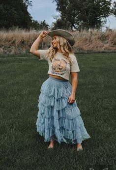 The Belle of the South Country Victorian Midi is a modern southern dream. Featuring textured and pin tucked shift material, Carolina blue color, ruffle detailing, an elastic waistband, and a tiered silhouette that falls into an ankle length cascade.  Perfect for lovers of southern and Victorian style. Dress it up with a bodysuit or down with a graphic tee. Make it your choice for roaming meadow photoshoots, vacation trips to a winery and orchard,  weddings, country music festivals, cottage retreats, and romantic pinics with woven baskets.  Rodeo Festival Graphic Tee available in other listings.  Waist: S 2-4 M 6-8 L 8-10 ● High rise  ● Elastic waist  ● Ultra-comfy & soft fabric ● Ankle Length  ● Lined ● Dusky Carolina blue color Boho Country Outfits, Western Wedding Guest, Weddings Country, Country Victorian, Country Western Wedding, Western Festival, Cottage Retreat, Southern Outfits, Western Style Outfits