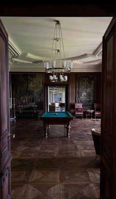 a pool table in the middle of a room