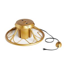 a gold metal object with a cord attached to the top and an electrical plugged into it