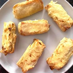 several pieces of bread on a white plate