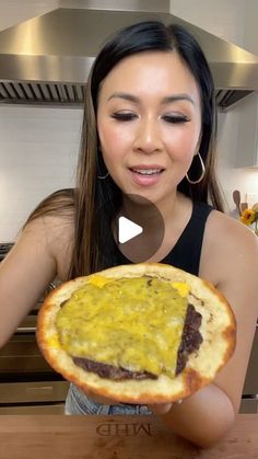 a woman holding up a baked item in front of her face, with the words chiquita written on it