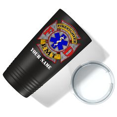 thermos cup is next to an emergency emblem on a white surface with a metal lid