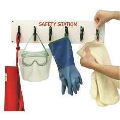 safety station with gloves and goggles hanging on hooks