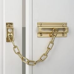 a close up of a door with a chain on the front and side of it