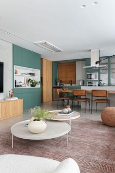 a living room filled with furniture and a flat screen tv