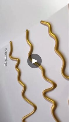 the video is showing how to make decorative gold wire for wall hangings and other decorations