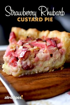 strawberry rhubarb custard pie on a cutting board with a fork