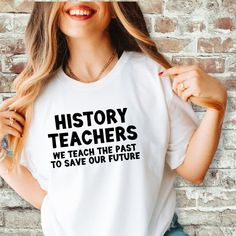 a woman wearing a t - shirt that says history teachers we teach the past to save our future