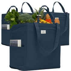 two blue grocery bags filled with fresh vegetables and fruits, all on top of each other