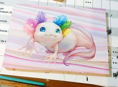 a painting of a gecko with colorful hair on it's head sitting on top of a piece of paper