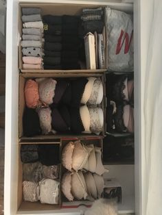 an open closet filled with lots of clothes