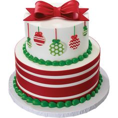 a three tiered christmas cake decorated with ornaments