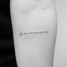 a woman's arm with the word, i am manaena written in cursive