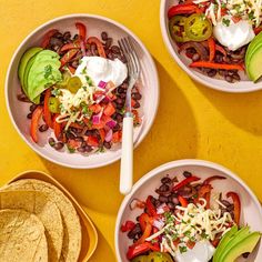 three bowls filled with different types of food on top of a yellow tablecloth next to tortillas