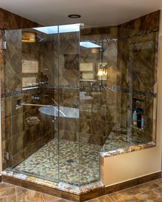 a walk in shower sitting inside of a bathroom