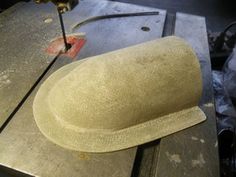 a hat is being worked on by a machine