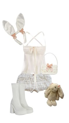 a woman's white outfit and booties with a teddy bear next to it