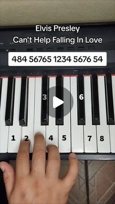 someone is playing the piano with their fingers and finger pressing it to play music on the keyboard