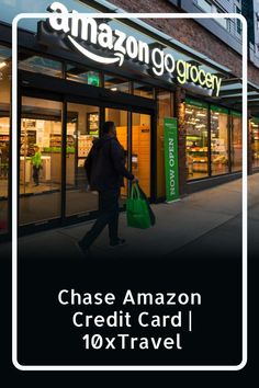 a person walking down the sidewalk with a green bag in front of an amazon store