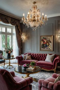 a living room filled with furniture and a chandelier