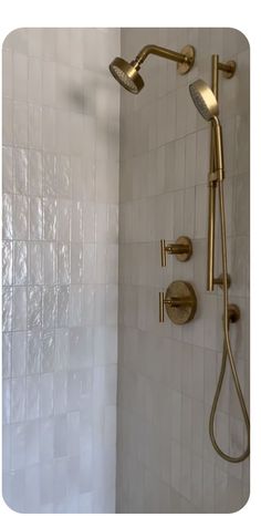 the shower head and handset are gold in color