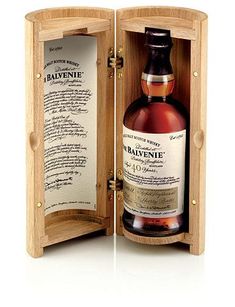 a bottle of rayvene single cask whisky in a wooden case with the label printed on it