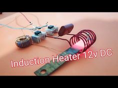 an electronic device with wires attached to it and the words induction heater 2 v dc