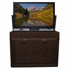 a television sitting on top of a trunk