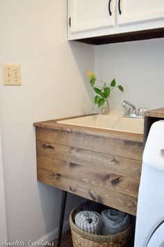 a washer and dryer sitting next to each other in a bathroom