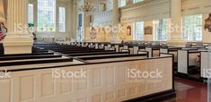 the interior of a church with pews and chandeliers stock photo - rights