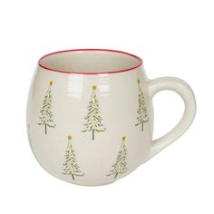 a white coffee cup with trees painted on the side and red trim around the bottom