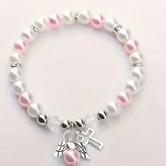 Delicate Angel Wing Cross Charm Bracelet - Exquisite Pink And White Faux Pearls. White Adjustable Hypoallergenic Rosary Bracelet, Adjustable Hypoallergenic White Charm Bracelet, Cross Bracelets, Christian Bracelets, Rosary Bracelet, Girly Accessories, Cross Bracelet, Cross Charms, Pink Bracelet