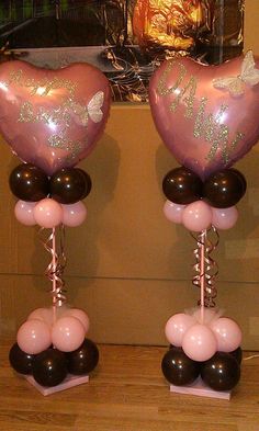 two heart shaped balloons on top of each other