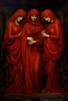 three women dressed in red standing next to each other with their arms around one another