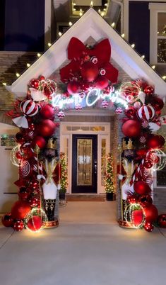 an entrance decorated with christmas decorations and lights