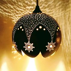 a black and white ornament hanging from a ceiling