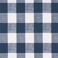 a blue and white checkered fabric with a ruler in front of the plaid pattern