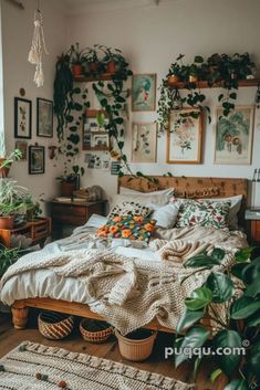 a bedroom with lots of plants and pictures on the wall