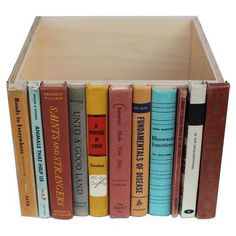 a book shelf filled with lots of books on top of each other in front of a white background