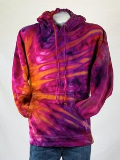 a purple and orange tie dye hoodie on a mannequin's head