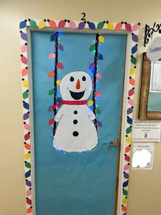 a door decorated to look like a snowman