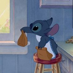 stitch is sitting on top of a stool and holding a bag in it's hand