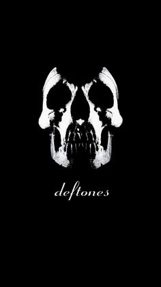 a black background with a white skull and the words deftones written in front of it