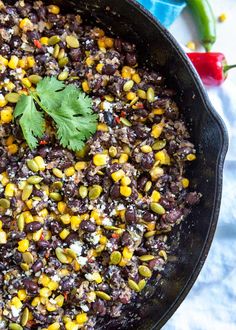 black beans, corn and cilantro in a cast iron skillet