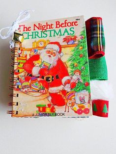 an old fashioned christmas book with santa claus